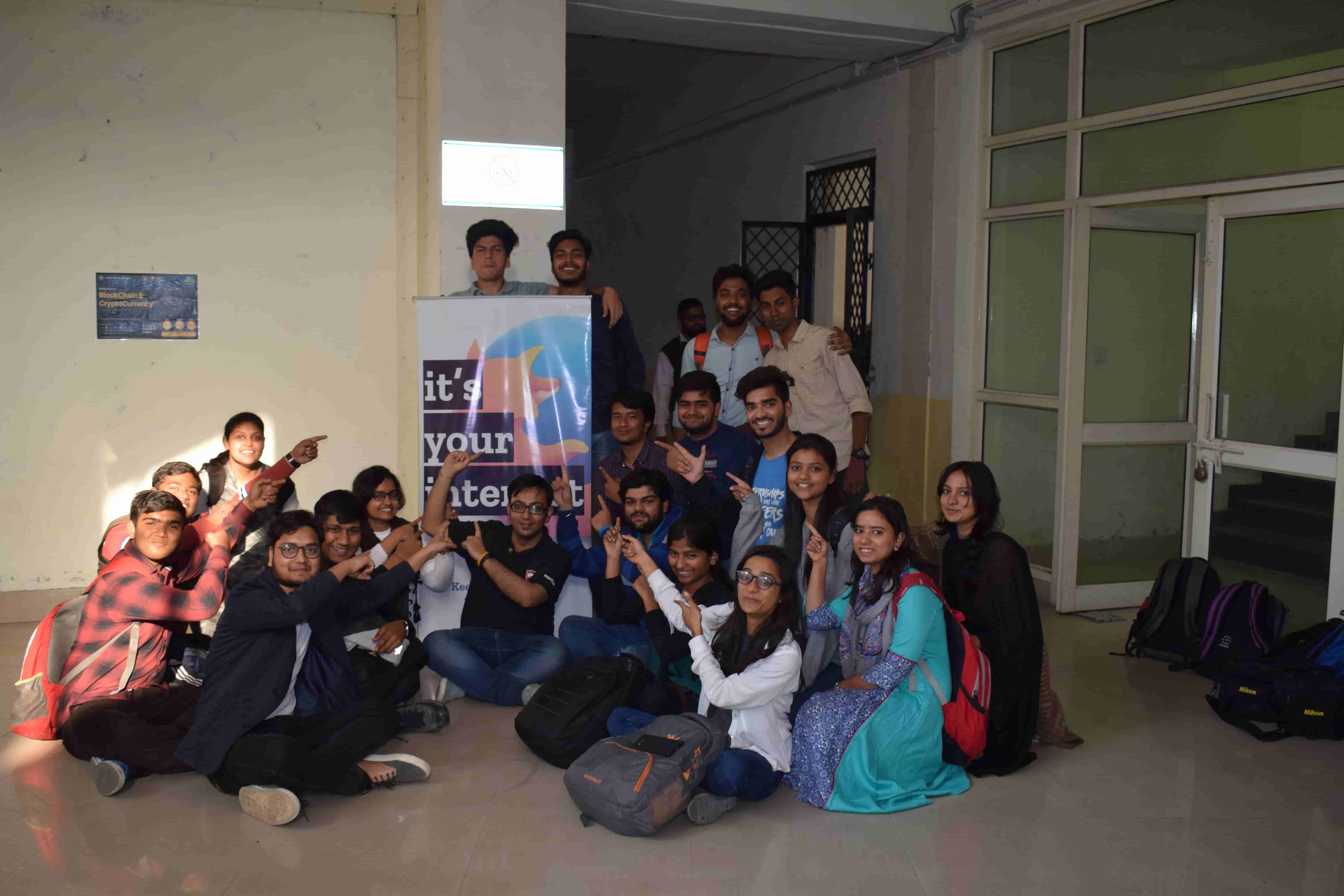 Core team in front of standee